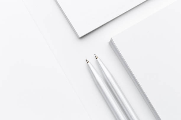 istock White blank business card. Office table desk with pencil. Top view 1256113061