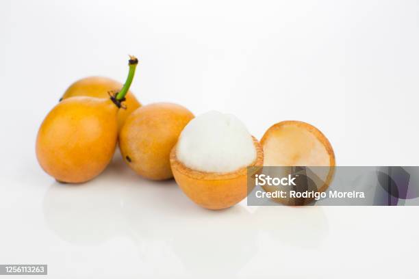 Open Bolivian Exotic Fruit Called Achachairu Isolated In White Background Stock Photo - Download Image Now