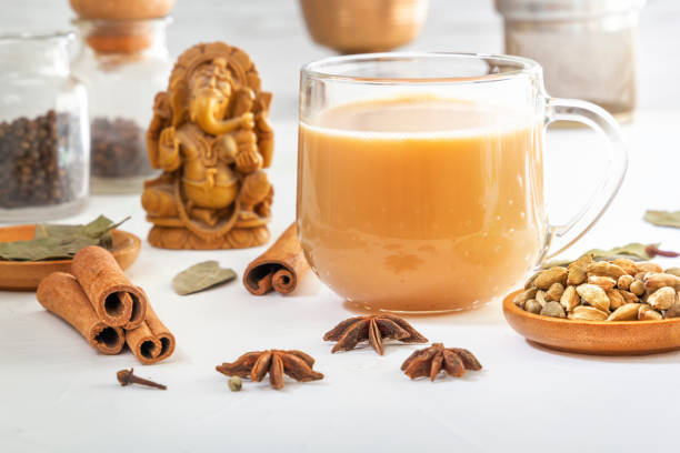 istock Star anise, cinnamon sticks, cardamom, bay leaf, pepper and other ingredients for making masala tea on a white wooden table 1256113362
