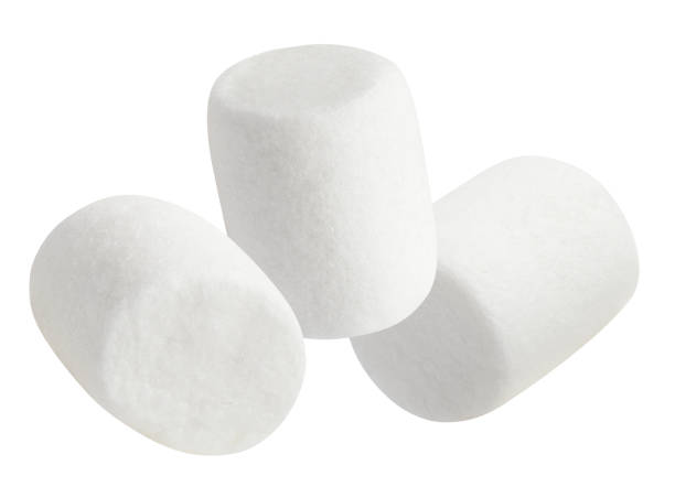 istock Delicious white marshmallows close-up on white 1256113554