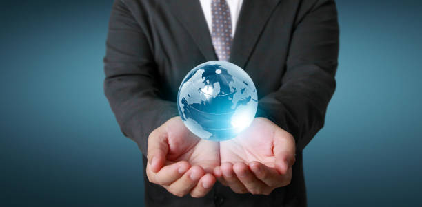 istock Globe ,earth in human hand, holding our planet glowing.  image provided by Nasa 1256114947