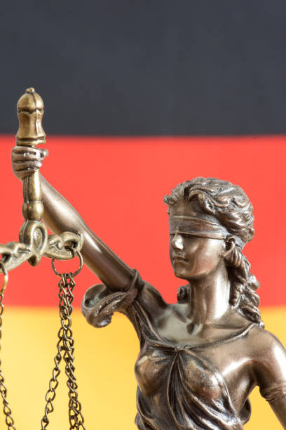 istock Justitia and flag of Germany 1256116827