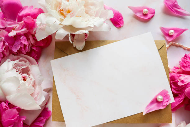 istock postcard mockup. pink peonies on a white background 1256117554