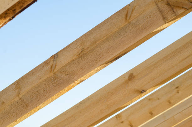 istock wooden bars against the sky. roof construction inside view 1256118088