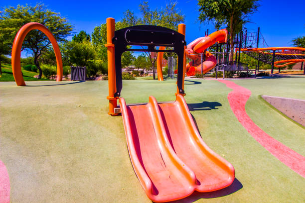 istock Slides & Playground Equipment At Free Public Park 1256119438