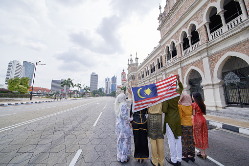 rear view Malaysia multi ethnic adults celebrating their independence day at merdeka square