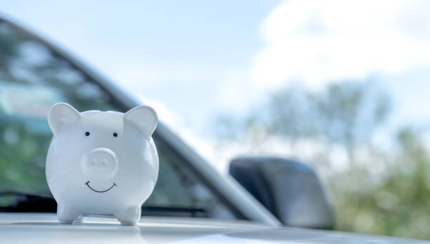 White piggy bank on the car, Money-saving concept for insurance, or traveling during retirement White piggy bank on the car, Money-saving concept for insurance, or traveling during retirement. travel refund stock pictures, royalty-free photos & images