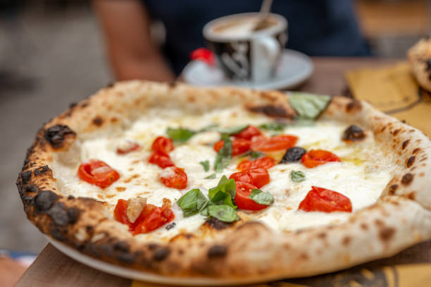 istock Freshly baked pizza with tomato, mozzarella and basil 1256122857