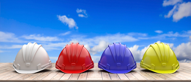 Work safety protection equipment. Industrial protective hardhats on wood shelf, blue sky background. Personal health and safety concept. 3d illustration