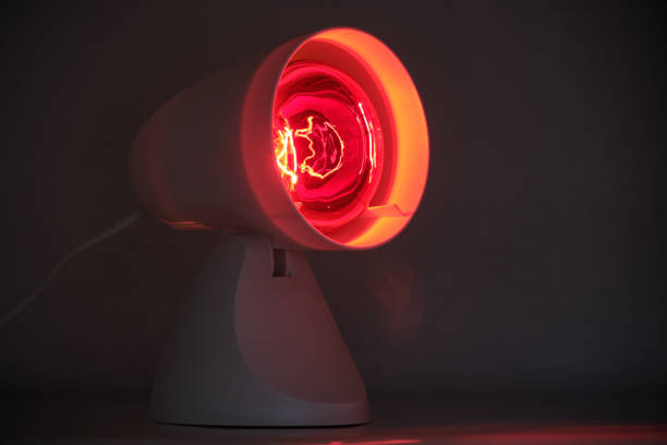 Close-up of infrared lamp glowing in the dark stock photo
