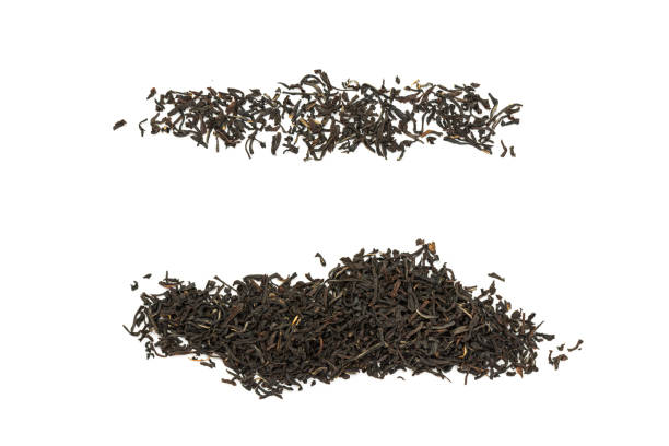 istock Fragrant Leaves of black premium dry tea on a white background 1256126326