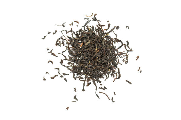 istock Fragrant Leaves of black premium dry tea on a white background 1256126361