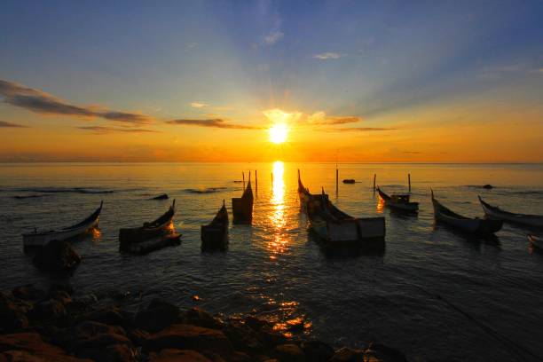 Enchantment of the Rising Sun on  Weh

Island Seeing the beauty of the morning at sunrise on the Sumur Tiga beach, Weh Island, Sabang City, Aceh Province August 16, 2015. Weh Sabang Island is a tourist destination, because on this island a variety of beauties are available, ranging from natural panoramas to well-known underwater beauty,  even tourists every day can enjoy the sunrise and sunset. sabang beach stock pictures, royalty-free photos & images