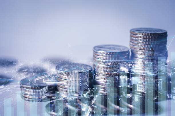 istock double exposure of city with row of coin stack with growth chart and graph progress report for business investment finance banking and money saving concept. 1256126970