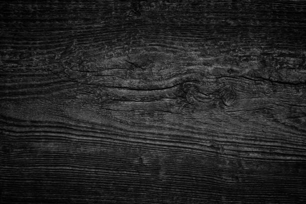 istock Black  gray wood plank texture surface as background 1256127649