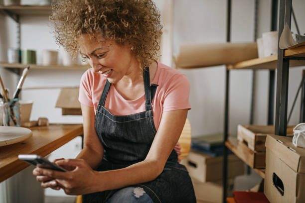 istock Online shopping makes my business successful 1256129475