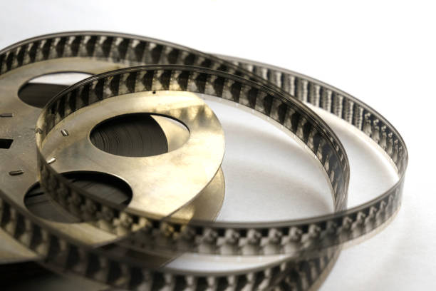 istock Film unwound from a metal cassette. Close-up. 1256130255