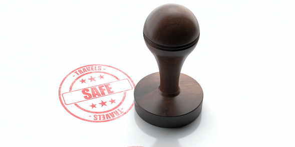 SAFE TRAVELS, PROTECTION stamp. Wooden round rubber stamper and stamp with text safe travels isolated on white background. Fearlessly, security message with red ink. 3d illustration