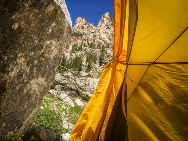 istock Yellow Backpacking Tent in the Mountains 1256132573