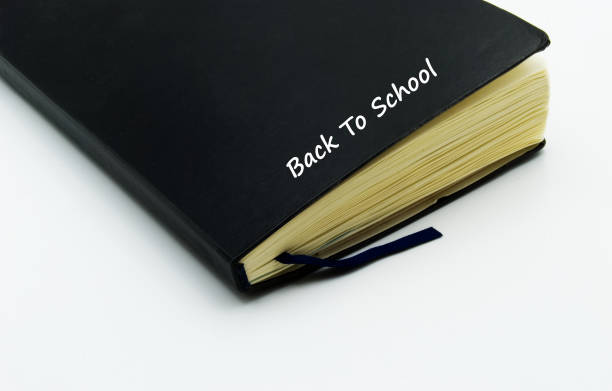 istock Black notebook isolated on white background. Back to school concept 1256133701