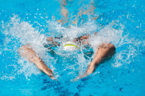 istock Woman Swimming In Pool 1256134010