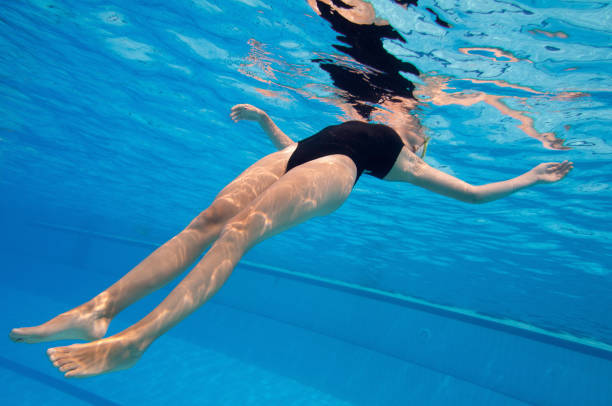 istock Woman Swimming In Pool 1256134331