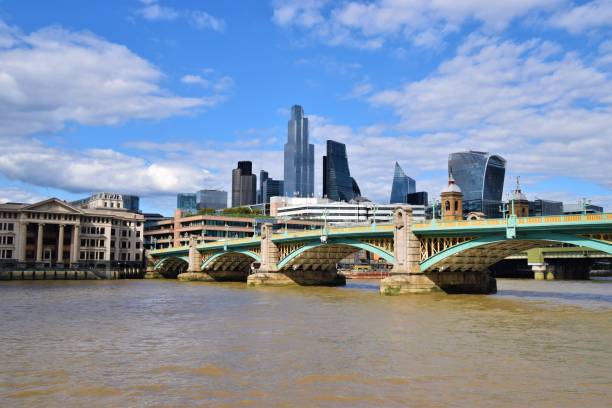 Southwark Bridge and City of London, United Kingdom London, United Kingdom - July 11 2020: Southwark Bridge, River Thames and City of London skyline daytime view waterloo bridge stock pictures, royalty-free photos & images