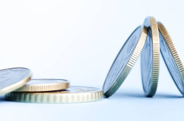 istock pennies lie unusually on a blue background 1256137122