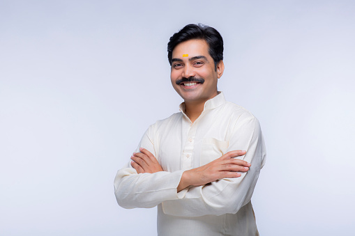 Happy young indian sikh businessman wearing suit do Ok gesture with hand isolated over white background. Corporate Concept.