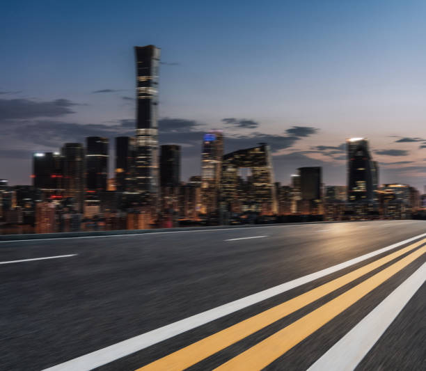 istock Empty Road Background of Beijing Skyline at Dusk 1256138459
