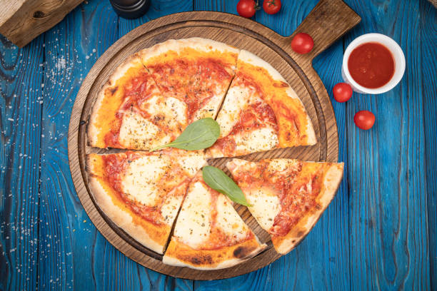 Italian pizza with cheeses and tomatoes