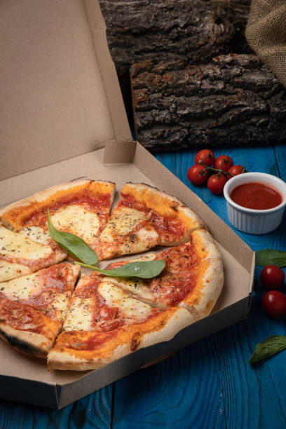 istock Italian pizza with cheeses and tomatoes 1256139134