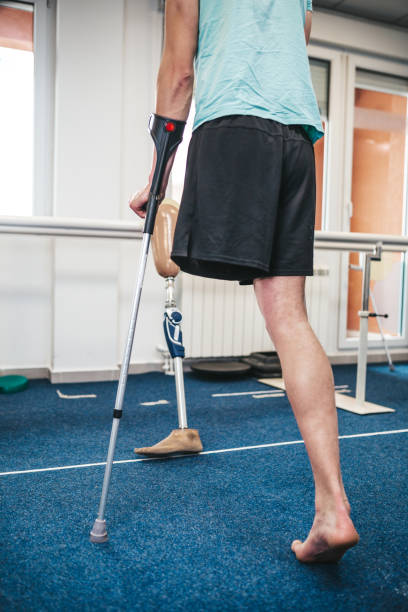 istock Disabled man at physiotherapy center 1256140361