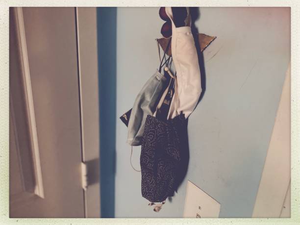 istock Face Masks Hanging by the Front Door 1256140373