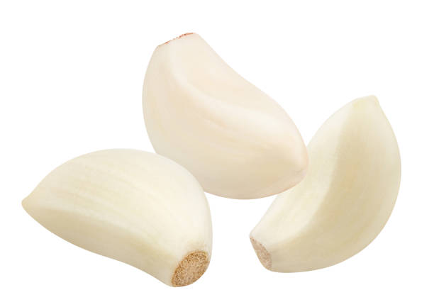 istock Delicious garlic cloves on white 1256140637