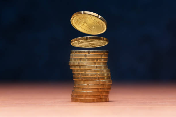 istock Stack of 20 Euro cents coins over dark blue background 1256141626