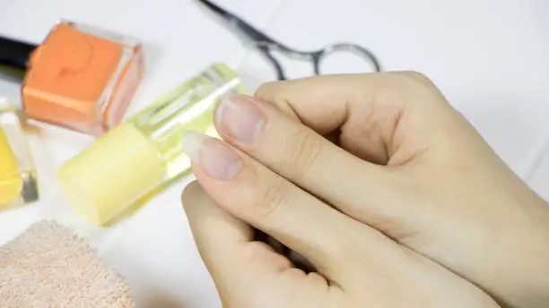 Manicure. Choose the length of your nails. Compare long and short nails. Thumb. Fingernail, gesturing, hygiene, spa, cosmetic, skin, treatment, care, home, beauty treatment.