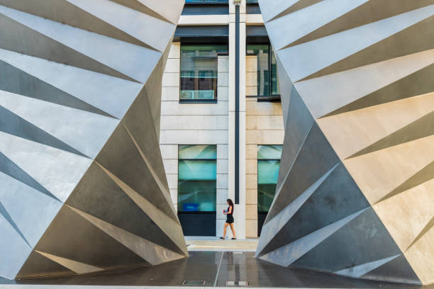 January 2020 London. A girl walking past the Paternoster Vents, London, England