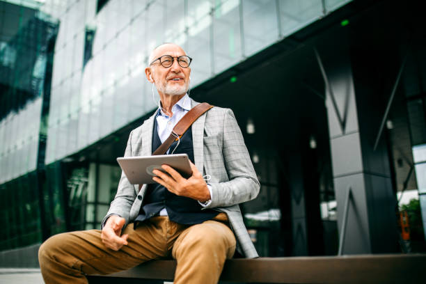 istock Businessman with digital tablet on a video chat call 1256143218