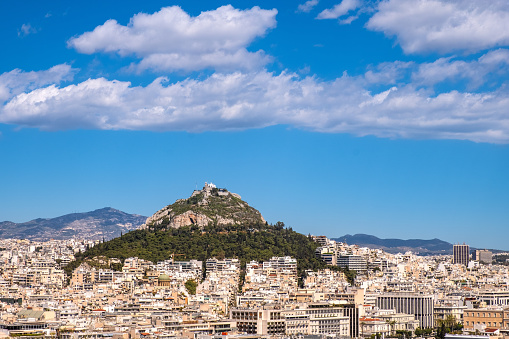 Panoramic view of metropolitan Athens, Greece with Lycabettus hill seen from rocky top of Acropolis hill