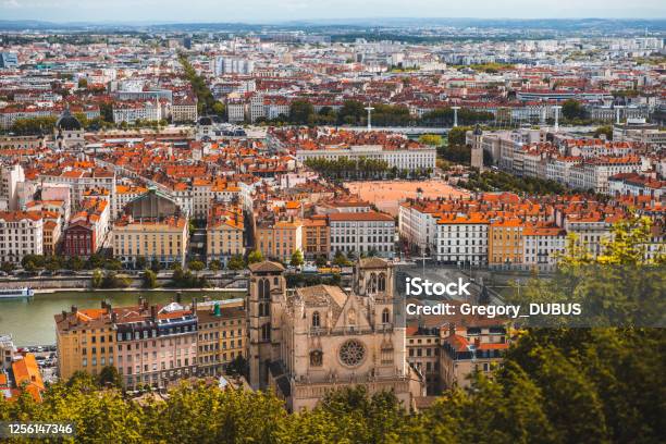 Aerial View Of Lyon French Cityscape With St Jean Cathedral Monument Along Saone Riverbank And Red Rooftops From Place Bellecour Stock Photo - Download Image Now