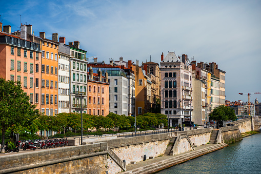 Saone riverbank in Lyon old town, Vieux Lyon district, with colorful residential apartments. Photo taken in Lyon famous city, Unesco World Heritage Site, in Rhone department, Auvergne-Rhone-Alpes region in France, Europe during a sunny summer day.