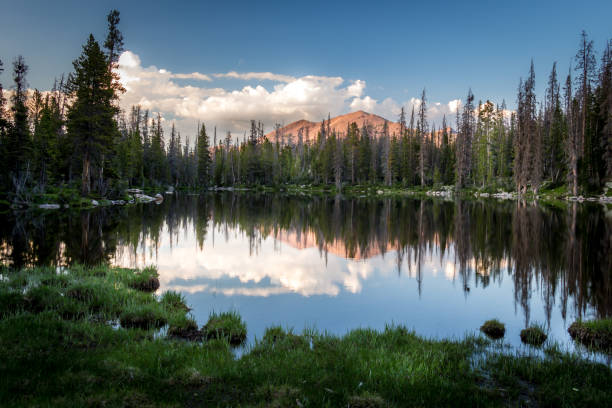 istock Crystal Mountain Lake Reflecting The Mountains 1256148600
