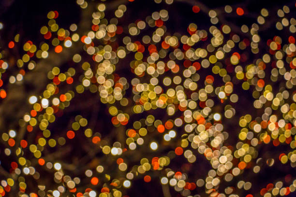 istock Orange Yellow and White Christmas Lights Bokeh 1256148603