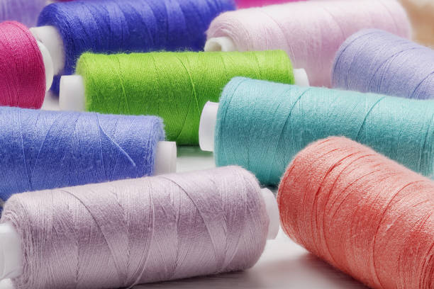 istock Sewing kit. Colored threads on bobbins blue, green ,red. 1256148673