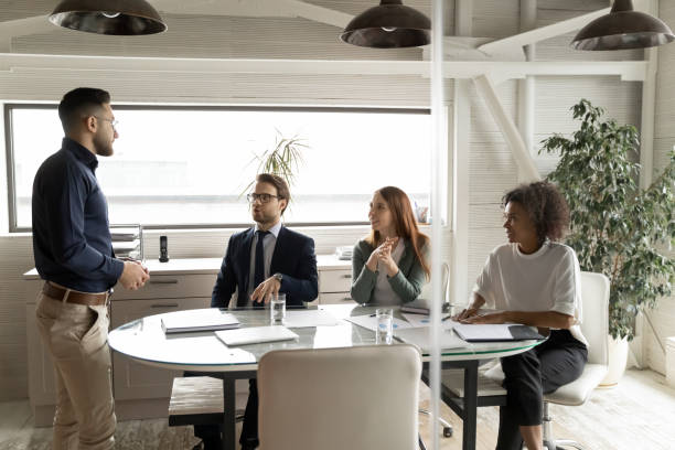 istock Multiracial colleagues brainstorm at group meeting in office 1256152595