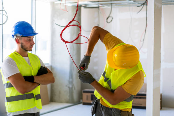istock Electrician making wiring at new house 1256152787