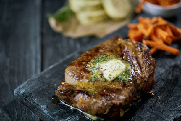 istock Beef steak with garlic butter 1256153437