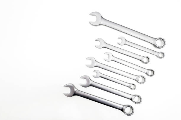 Spanner Set Isolated. Silver coloured spanners lying side by side in white background. stock photo