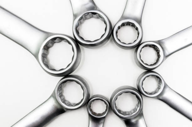 Chrome ring spanners of various sizes were in contact with each other. Isolated on a white background. stock photo